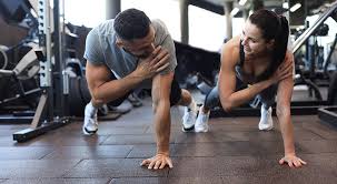 Toning Bingo Wings: Your Ultimate Guide to Sculpting Sleek Arms at the Gym 3 Fitness trainer demonstrating arm toning exercises Wales