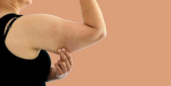 Toning Bingo Wings: Your Ultimate Guide to Sculpting Sleek Arms at the Gym 1 Woman doing push-ups for arm strength Wales