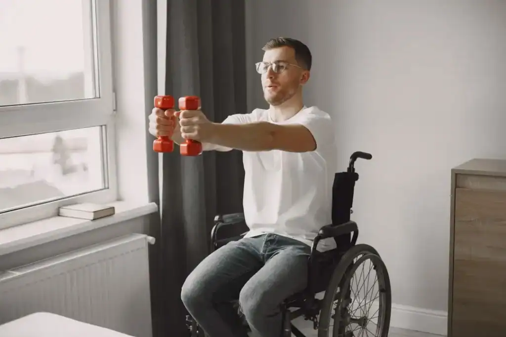 Image of man doing exercise in his wheelchair to aid weight loss Wales