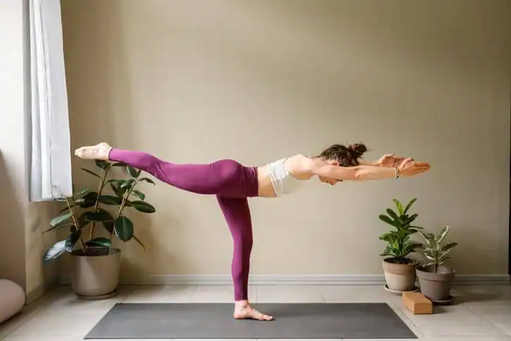 Achieving the Perfect Tone: How Often Should You Exercise for Results? 1 Woman doing Yoga exercise Wales to help with toning the body.